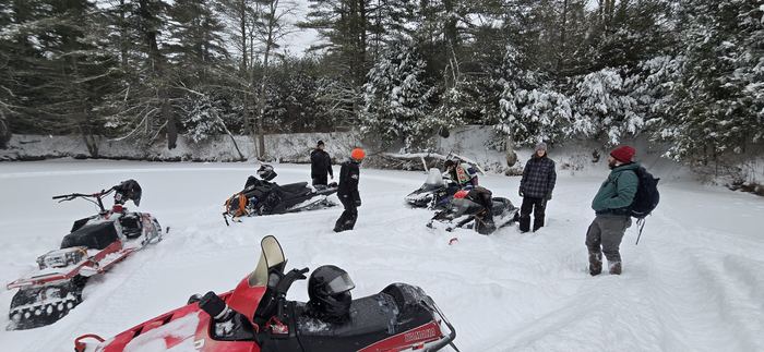 Riders regrouping on a frozen pond