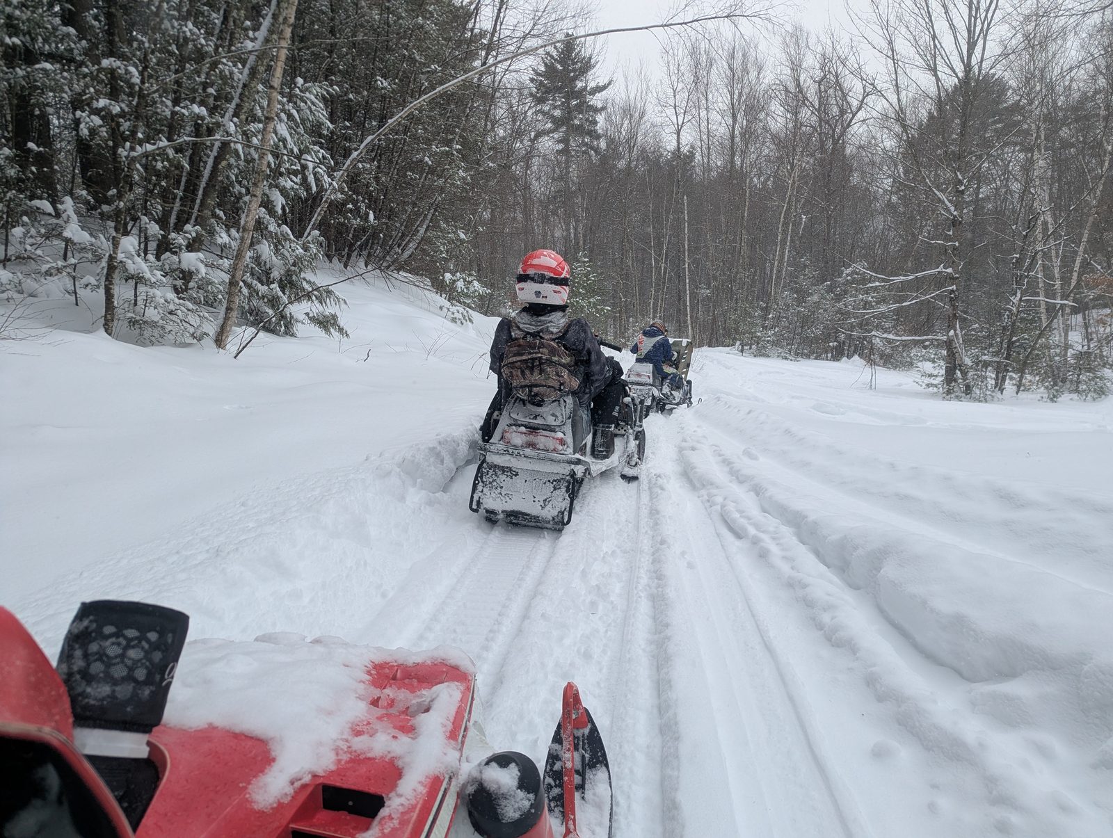 Riding single file down a freshly covered trail